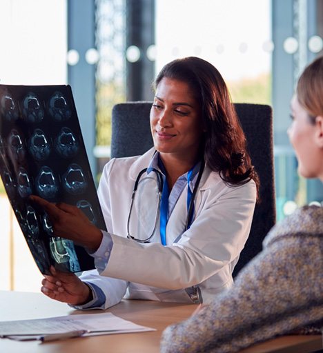 female doctor discussing scan results with woman at apollo jbp hospital