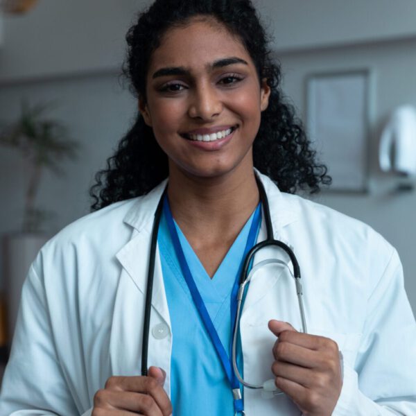 portrait-of-smiling-mixed-race-female-doctor-with-2023-11-27-05-31-43-utc